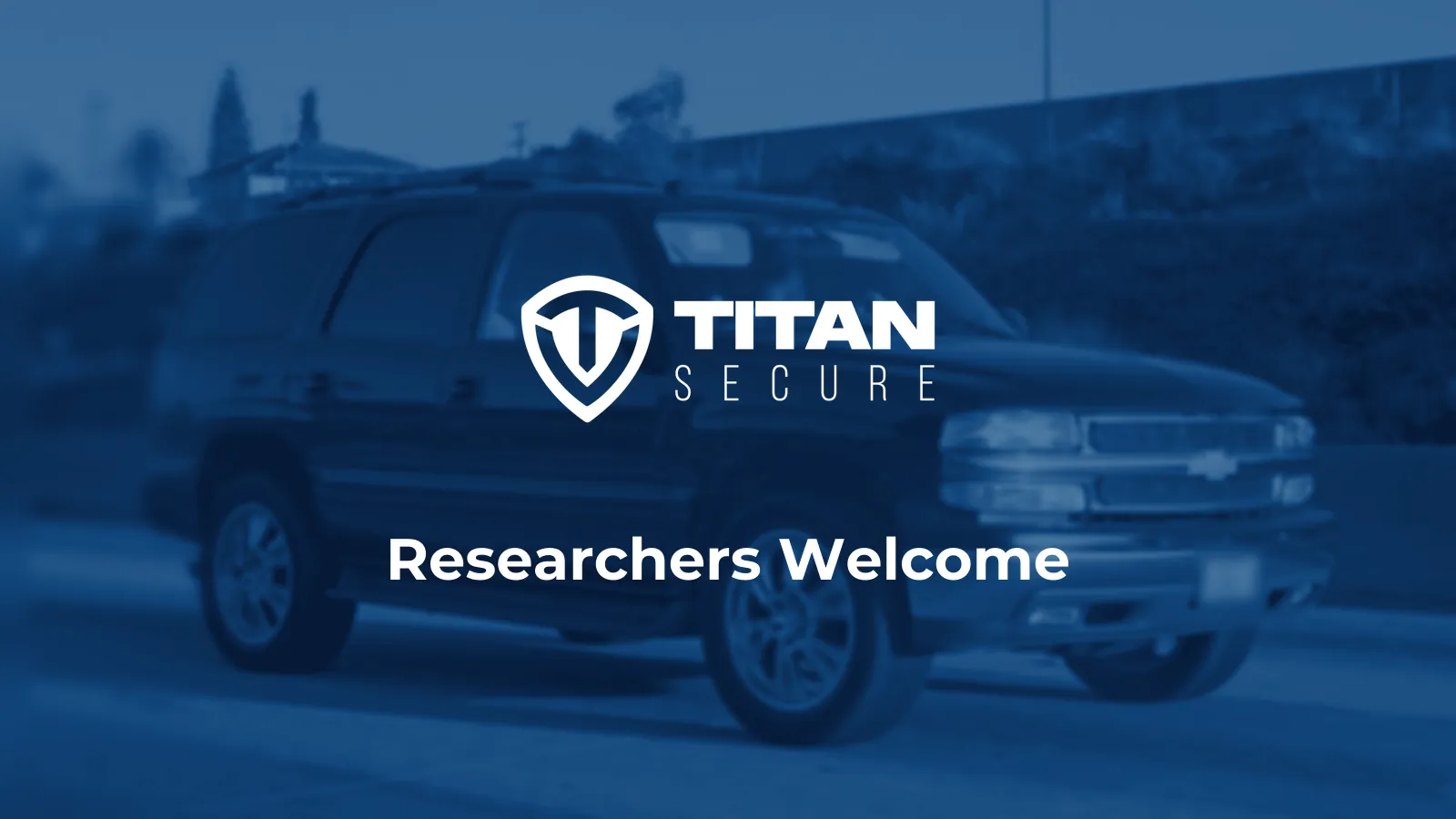 An SUV on a freeway in blue tones, with the Titan Secure logo and the headline Researchers Welcome.